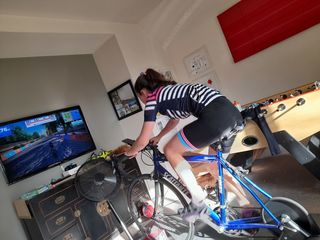 Sophia racing in the Sailor Jersey on Zwift